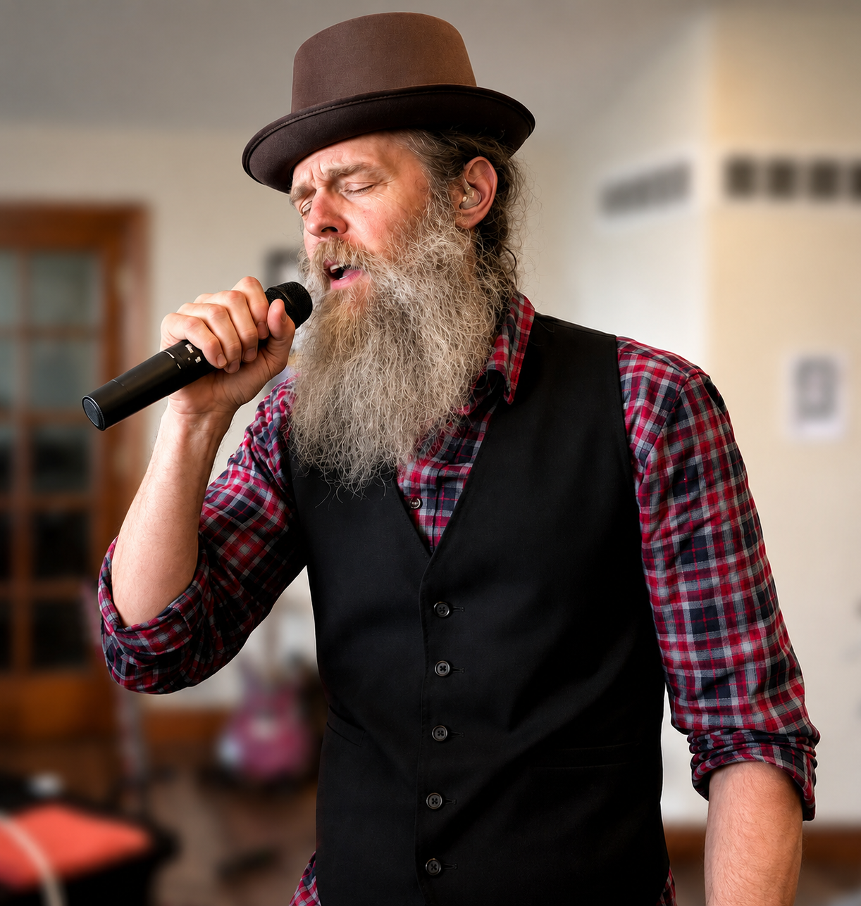Bradley of CAKEMIX singing into wireless mic June 29, 2025