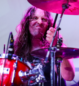 Kyle of CAKEMIX playing the drums